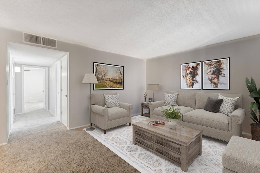 a living room with a couch and a coffee table at Acacia Gardens, Albuquerque, New Mexico